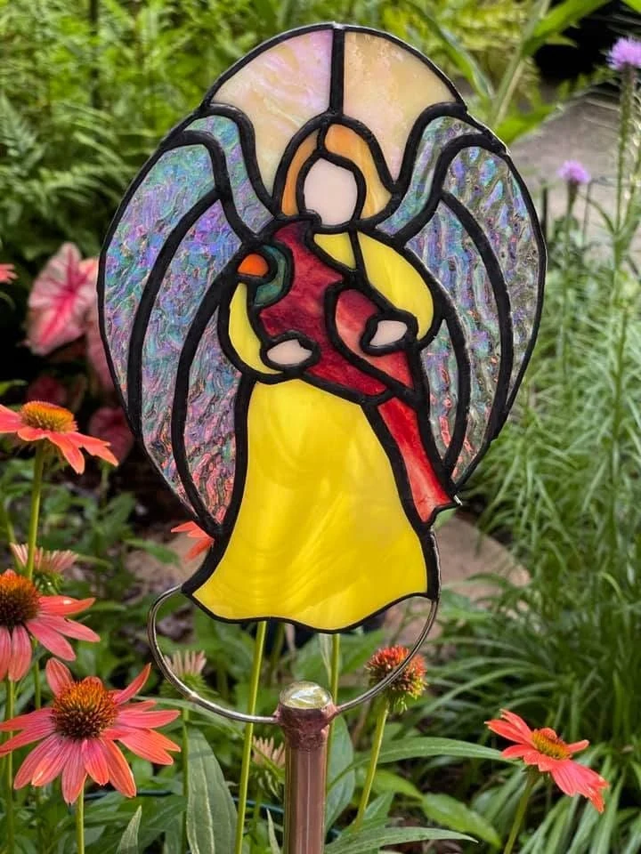 Angel with red bird garden stake — original photograph