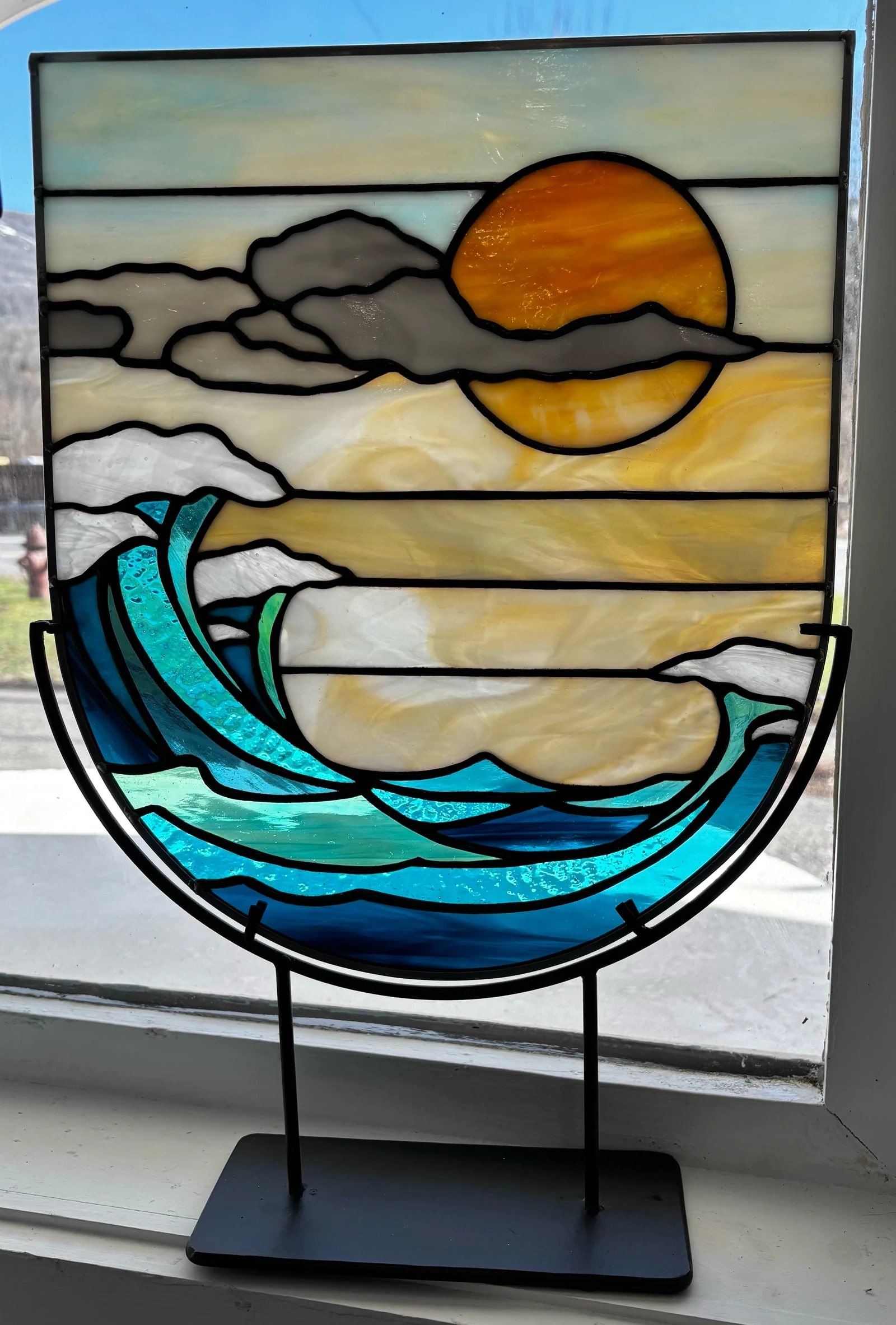 The finished sun and wave shield